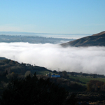 A cloud inversion hovers around the valley.