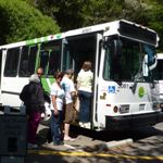 Photo of visitors boarding the Muir Woods Shuttle/Marin Transit Route 66. The Muir Woods Shuttle brings passengers within steps of the entrance on weekends and holidays, only in the summer.