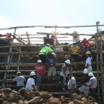 Workers restoring wall at Puukohola Heiau NHS