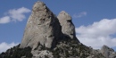Twin Sisters granite spires against a summer sky. Twin Sisters granite spires against a summer sky.