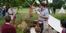 A park Guide presents a program at the Brigade Encampment special event A park Guide presents a program at the Brigade Encampment special event