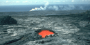 Skylight reveals lava flowing to the ocean. Skylight reveals lava flowing to the ocean.
