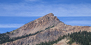 brokeoff mountain set against a deep blue sky brokeoff mountain set against a deep blue sky