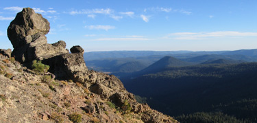 rock formation on top of diamond peak with panoramic of valley below