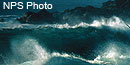 Waves crashing on rocks during a storm. Waves crashing on rocks during a storm.
