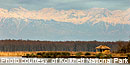Kolkheti National Park: Ranger shelter on Paliastomi Lake with the Caucasian mountain range in the background. Kolkheti National Park: Ranger shelter on Paliastomi Lake with the Caucasian mountain range in the background.