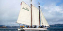 The scow schooner ALMA, with white sails raised, sailing on SF Bay. The scow schooner ALMA, with white sails raised, sailing on SF Bay.