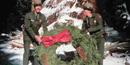 Rangers lay a wreath at the foot of the General Grant Tree, the Nation's Christmas Tree. Rangers lay a wreath at the foot of the General Grant Tree, the Nation's Christmas Tree.