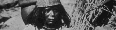 Paiute woman with woven hat. Eastern California Museum.