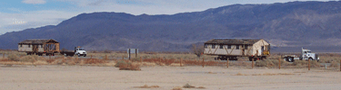 Mess hall sections are moved to Manzanar. NPS Photo.