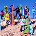 Crazy Cactus project participants with sculpture