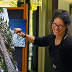 Becky Fletcher painting at the North Cascades Visitor Center in 2009. NPS Photo