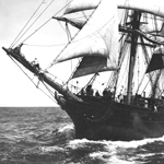 A historic photo of the bow section of a 19th century full-rigged sailing ship.