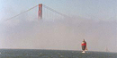 Fog envelopes San Francisco Bay, leaving only the top of the Golden Gate Bridge visible. Fog envelopes San Francisco Bay, leaving only the top of the Golden Gate Bridge visible.