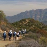 Hikers travel along the Backbone Trail looking at the high peaks of the Santa Monica Mountains. Photo by Jim Belsley.