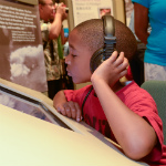 Young visitor enjoys the Timeline Exhibit