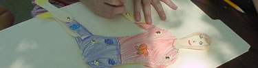 children making a paper jumping jack toy