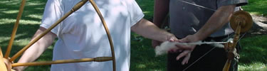 Visitor using large spinning wheel