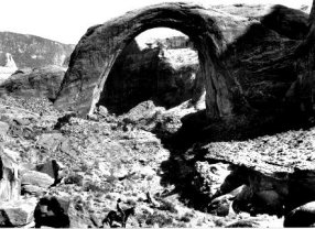 cowboy looking at Rainbow Bridge