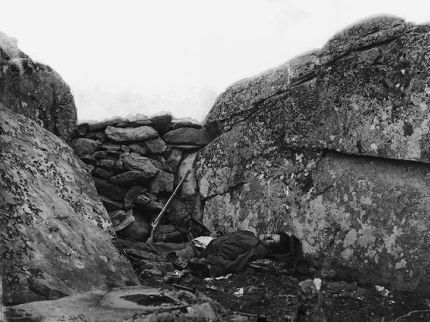 Photo of dead Confederate soldier, staged in Devil's Den
