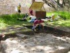 Photo of archeologist excavating the U.S. Armory grounds at Harpers Ferry