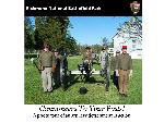 8 men in Civil War uniforms with cannon
