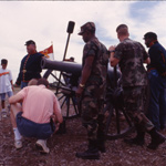A living history volunteer dressed as a Union artillerist talks to visitors at Malvern Hill.