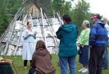 Interpreter speaks to visitors about Ojibwe cultural history.