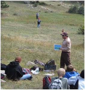 Photo Heart of the Rockies Environmental Education Intern Curtis teaching kids about geologic time