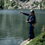 a photo of a fisherman at the lake