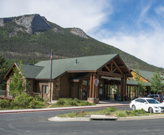 Photo of Fall River Visitor Center with Deer Mountain in the background. 