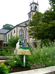 Colonial garden at Roger Williams National Memorial with church in the background