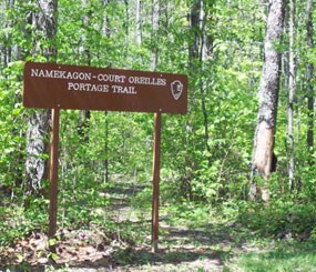 Sign identifies this trail in the woods as the Namekagon - Court Oreilles Portage Trail
