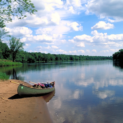 A canoe is pulled up to a sandbar on the lower St. Croix River in this image. NPS photo.