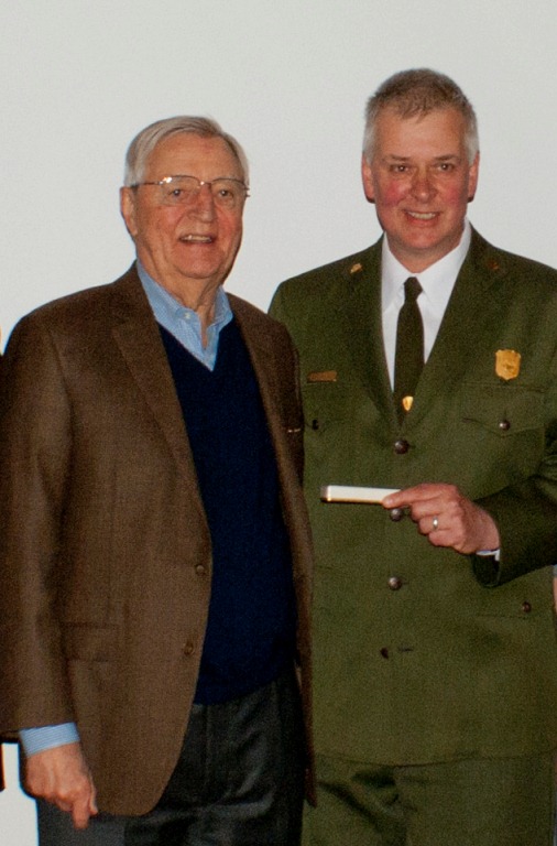 Former Senator and Vice President Walter Mondale and St. Croix National Scenic Riverway Superintendent Chris Stein appear together with the historic pen donated to the park. NPS photo.