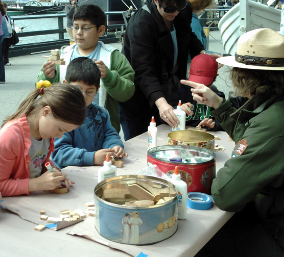 Children at a table doing crafts.