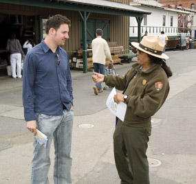Park Ranger Rubén Guzmán with a visitor on Hyde Street Pier. Park Ranger Rubén Guzmán with a visitor on Hyde Street Pier.