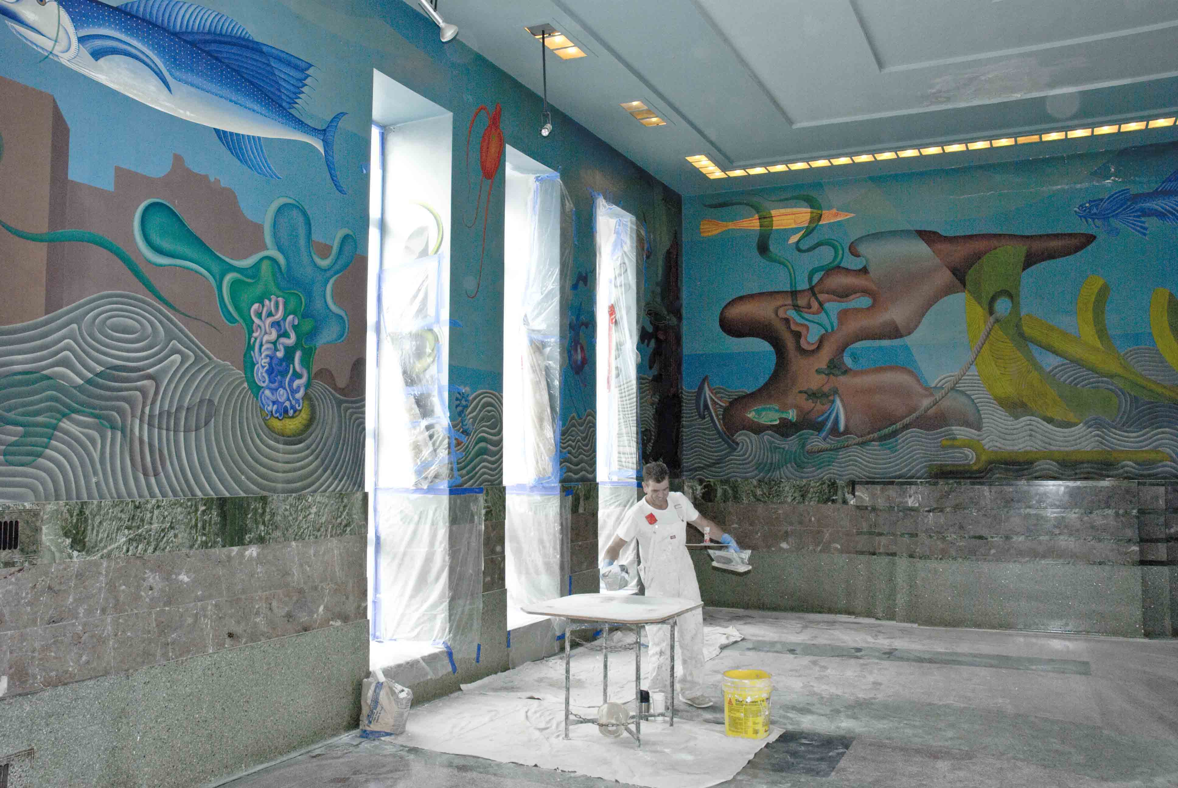 Interior of the Bathhouse building showing brightly-painted murals.