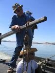 Frank Quan steers by manuvering the tiller.