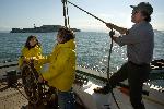 Captain and students at Alma's helm.