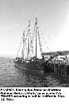 Thayer moored alongside a pier in 1957.