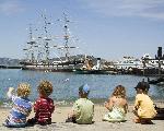 Children on the beach and a view of the lagoon.