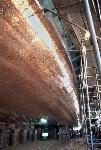 Shiny copper bottom of ferry boat out of water.