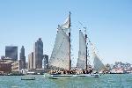 Flat bottomed schooner sails past SF skyline