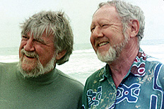 A color photo of two smiling men with beards. A color photo of two smiling men with beards.