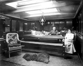 Captain and Mrs. Harrison in their cabin aboard the British ship Eva Montgomery, at Puget Sound, WA, ca. 1904 (Wilhelm Hester Collection).