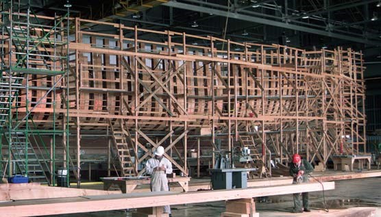 The ship's hull, with the rotten frames removed and covered with scaffolding.