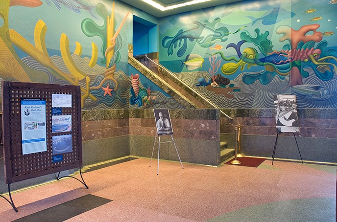 A corner section of a colorful mural on the walls of the Bathhouse lobby.