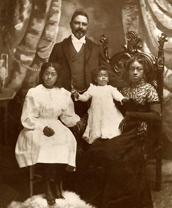 A formal portrait of Captain Shorey, his wife and two daughters.