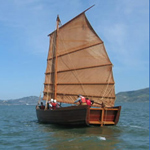 A replica of a Chinese shrimp junk sailing on San Francisco Bay.